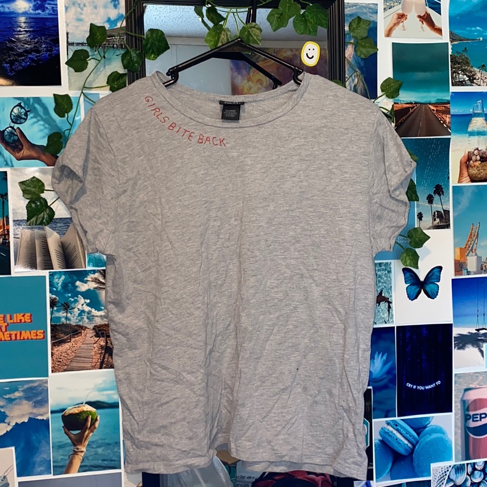 Gray “GIRLS BITE BACK” tee. Size XL. Fits smaller.